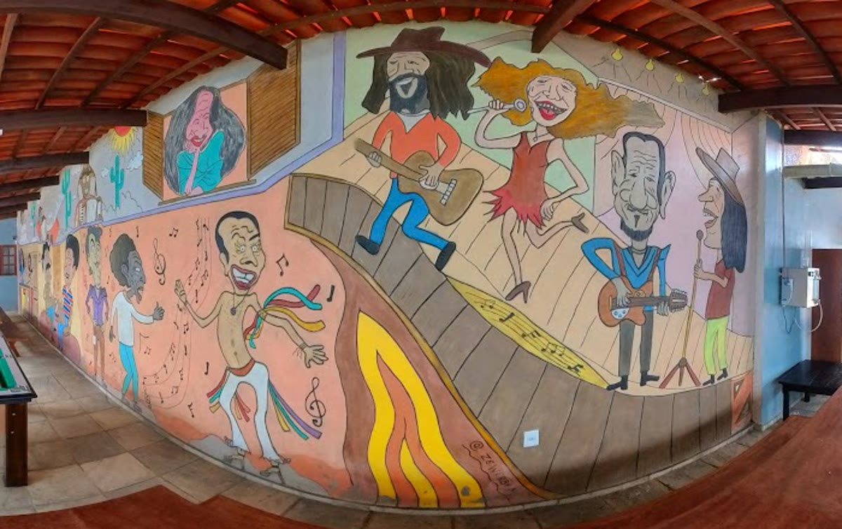 Área de lazer com mural colorido e sinuca